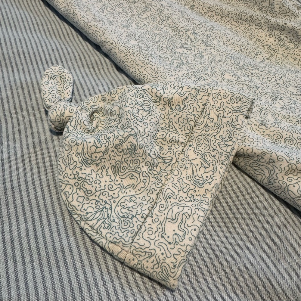 Organic Newborn Matching Hat and Swaddle with Blue and White Animal Pattern
